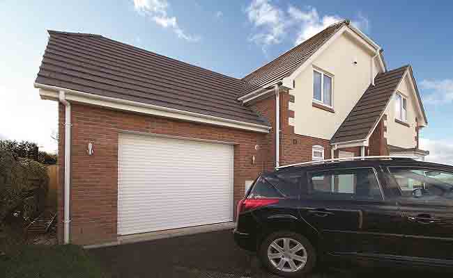 Gliderol insulated aluminium electric roller shutter garage door fitted to a single garage and finished with white powder coated paint.