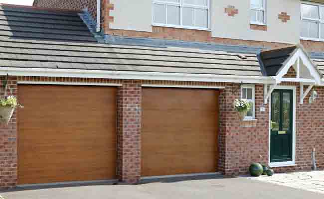 Gliderol flat panel sectional garage door in golden oak