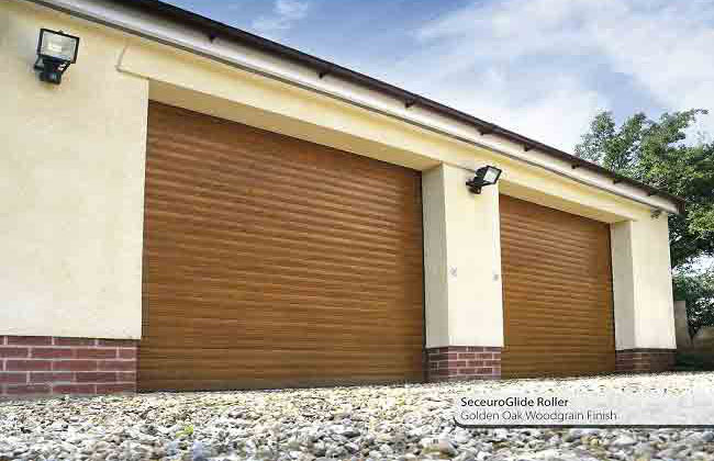 Golden oak seceuroglide insulated garage roller door fitted to large double garage