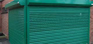 Galvanised roller shutter doors used to secure 2 shop fronts.
