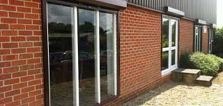 Seceuroshield 38 extruded aluminium roller shutters fitted over patio doors to gain additional security.