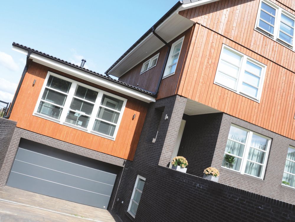 Birkdale Sectional Garage Door with a golden oak woodgrain finish combined with square windows