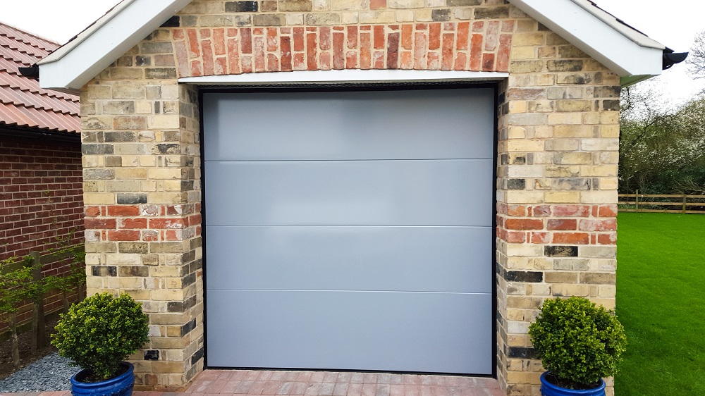 Birkdale Insulated Sectional Garage Door with a Light Grey Paint Finish.