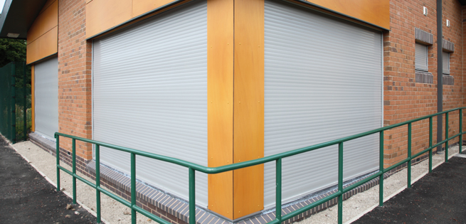 Extruded aluminium security roller shutter with a ligh grey powder coated paint finish.