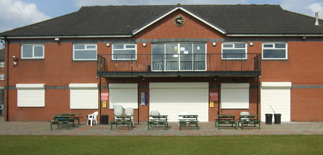 Security shutters fitted over windows and doors to secure a sports pavilion.