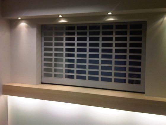 SWS SeceuroVision 800 security roller shutter doors painted blue used to secure a commercial kitchen.