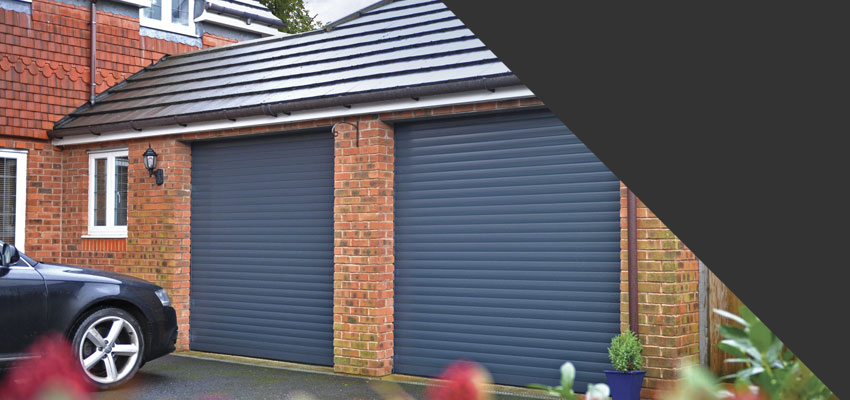 Anthracite Seceuroglide roller garage doors fitted to a double garage