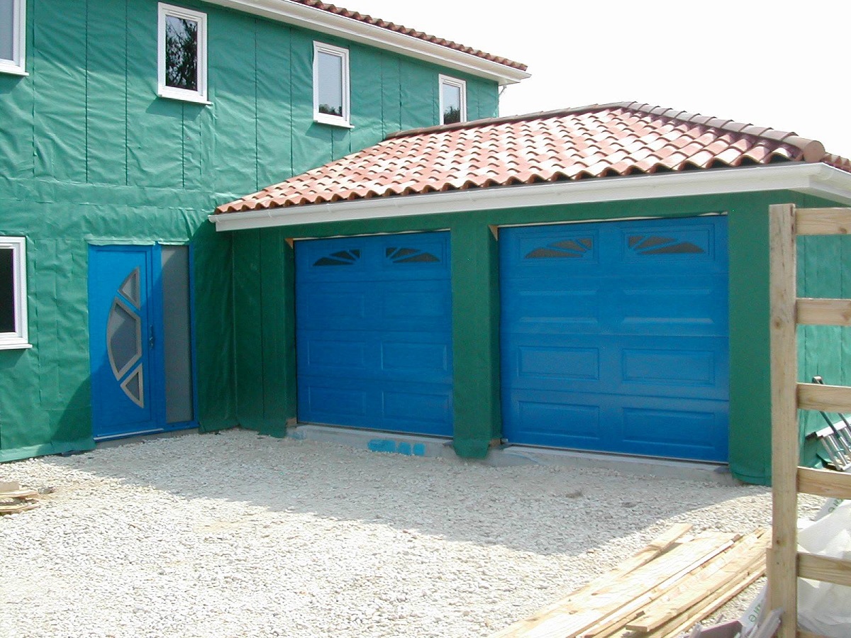 Gliderol insulated sectional garage doors with windows painted in a non standard RAL colour