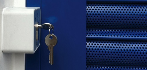 Perforated roller shutters with a close up view of the curtain showing the ventilation holes